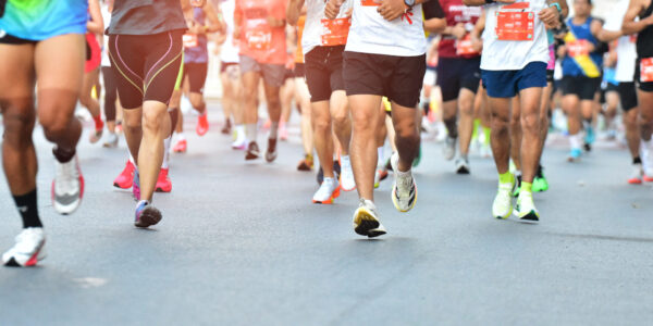 Marathon Running In The Light Of Morning, People Running On City Road Detail On Legs, Step, Walk And Outdoor Exercise Activities Concept.